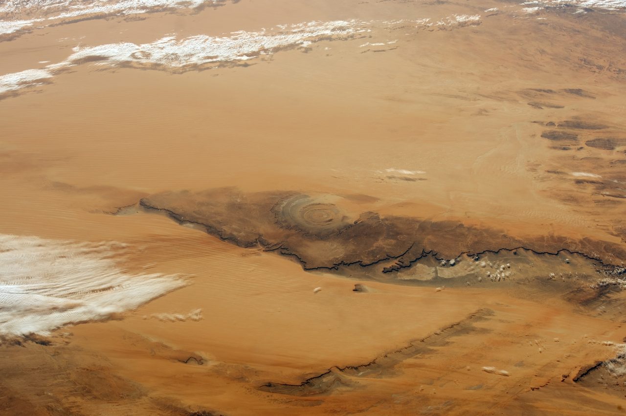 An astronaut photograph taken from the International Space Station showing the concentric rings of the Richat Structure in Mauritania