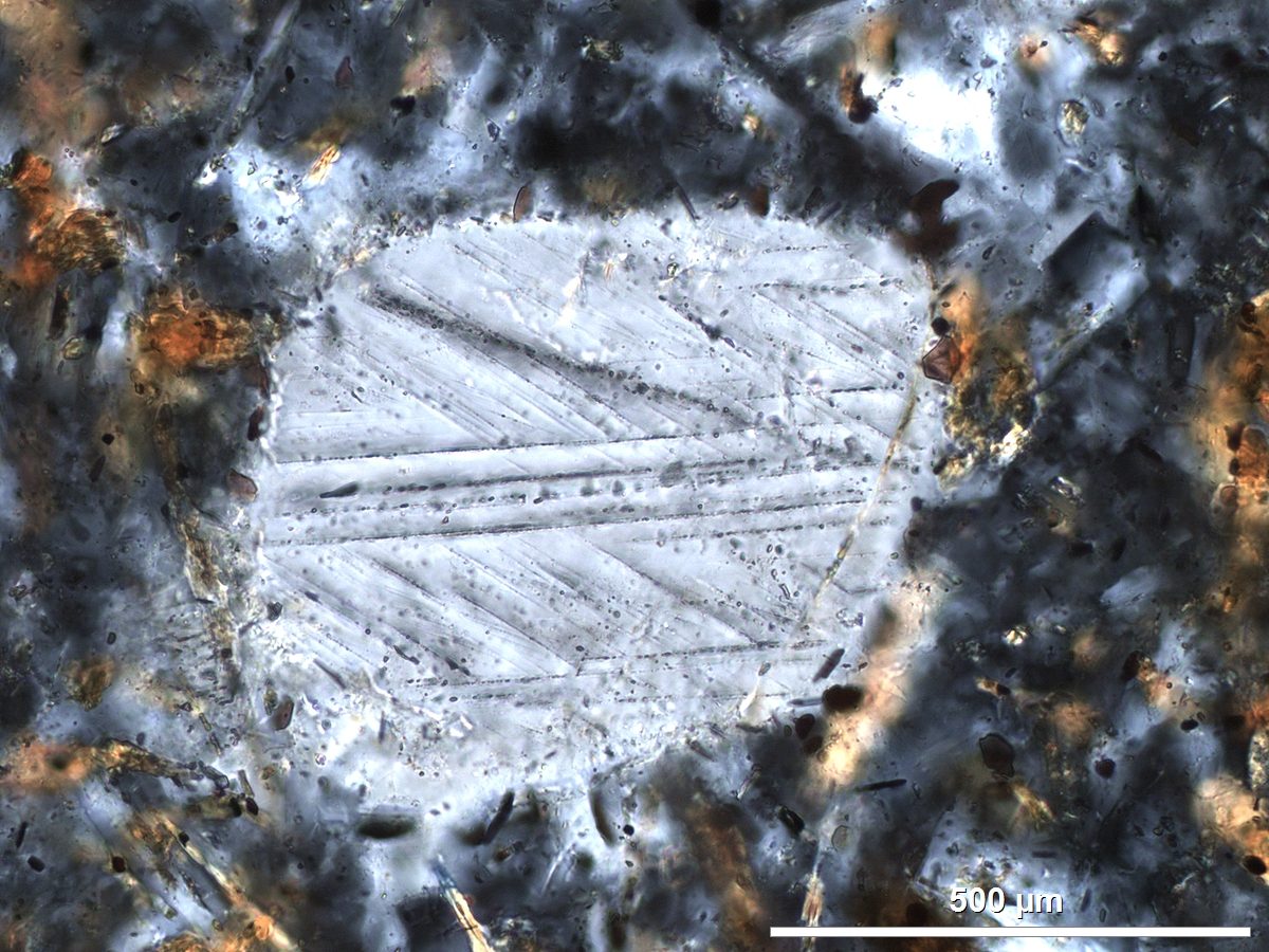 Photomicrograph under cross-polarized light of a shocked quartz grain from the Boltysh crater, Ukraine, showing planar deformation features