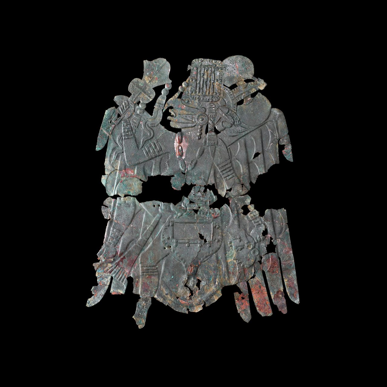A copper repousse plate depicting the Birdman figure, one of the two Rogan plates, held by the Smithsonian