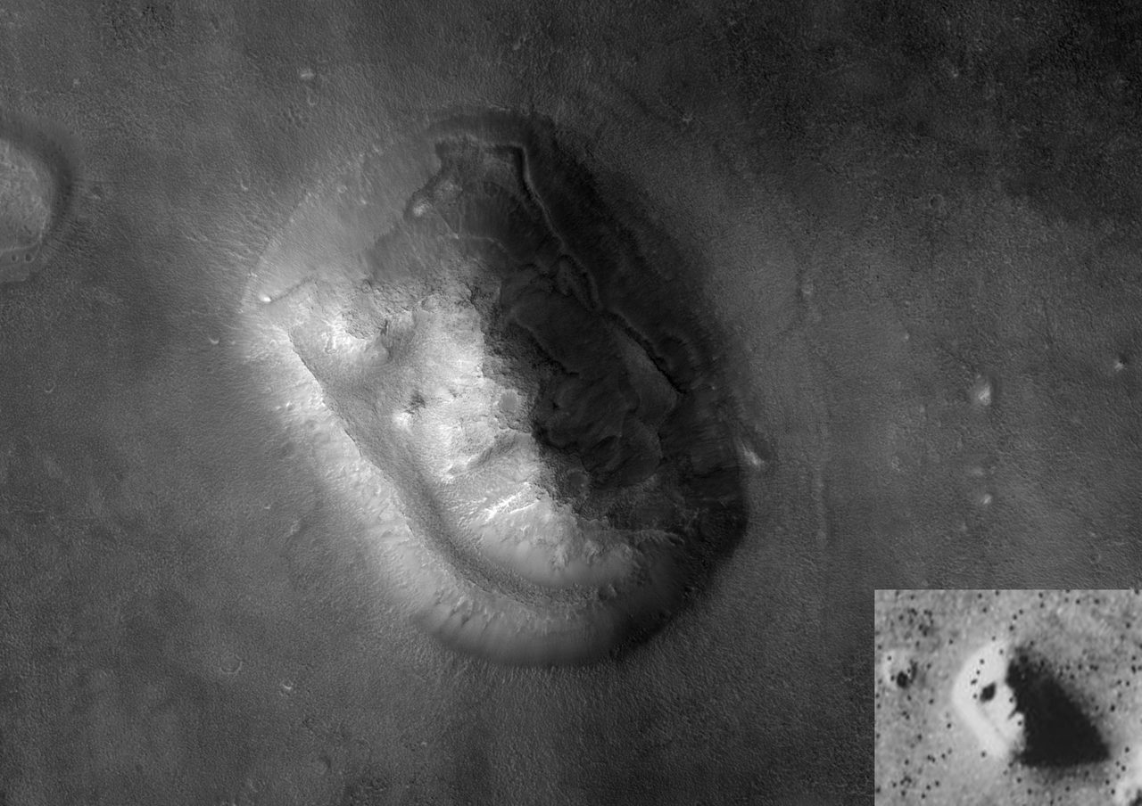 A grayscale orbital photograph of Mars in which a large rounded mesa with a terraced rim fills the centre of the frame, one side brightly lit and the other dropped into deep shadow, standing on a broad plain that carries the rim of a second smaller mesa at the far left; a small rectangular inset at the lower right holds a much coarser, grainier grayscale view of a pale rounded landform beside a large dark shadow, speckled throughout with tiny black dots
