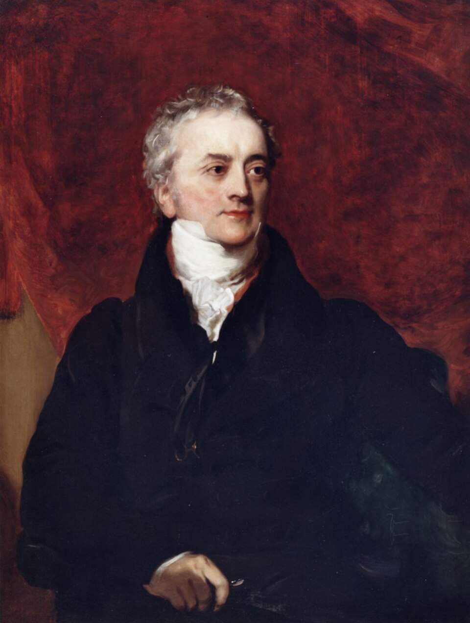 An oil portrait of an older man with grey curly hair, seated in a dark coat with a high white cravat, against a rich red drapery background, holding something in one hand
