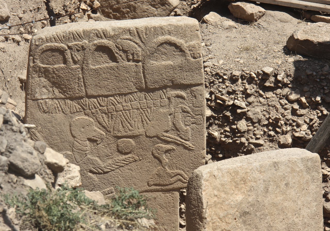 Pillar 43, the Vulture Stone, in Enclosure D at Gobekli Tepe, carved with a large bird, a scorpion, and a headless human figure