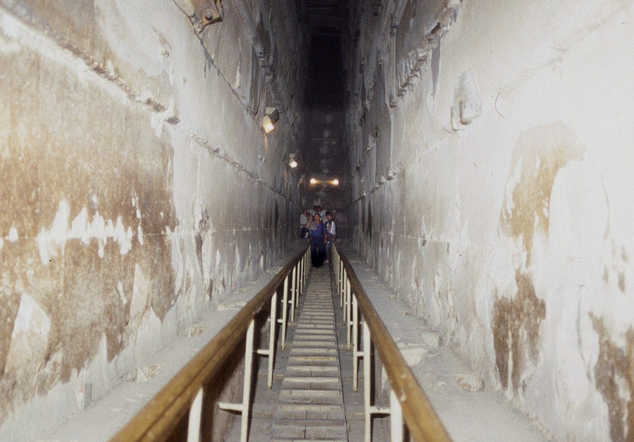 Looking upward along the corbelled Grand Gallery inside the Great Pyramid, its stone walls stepping inward as they rise