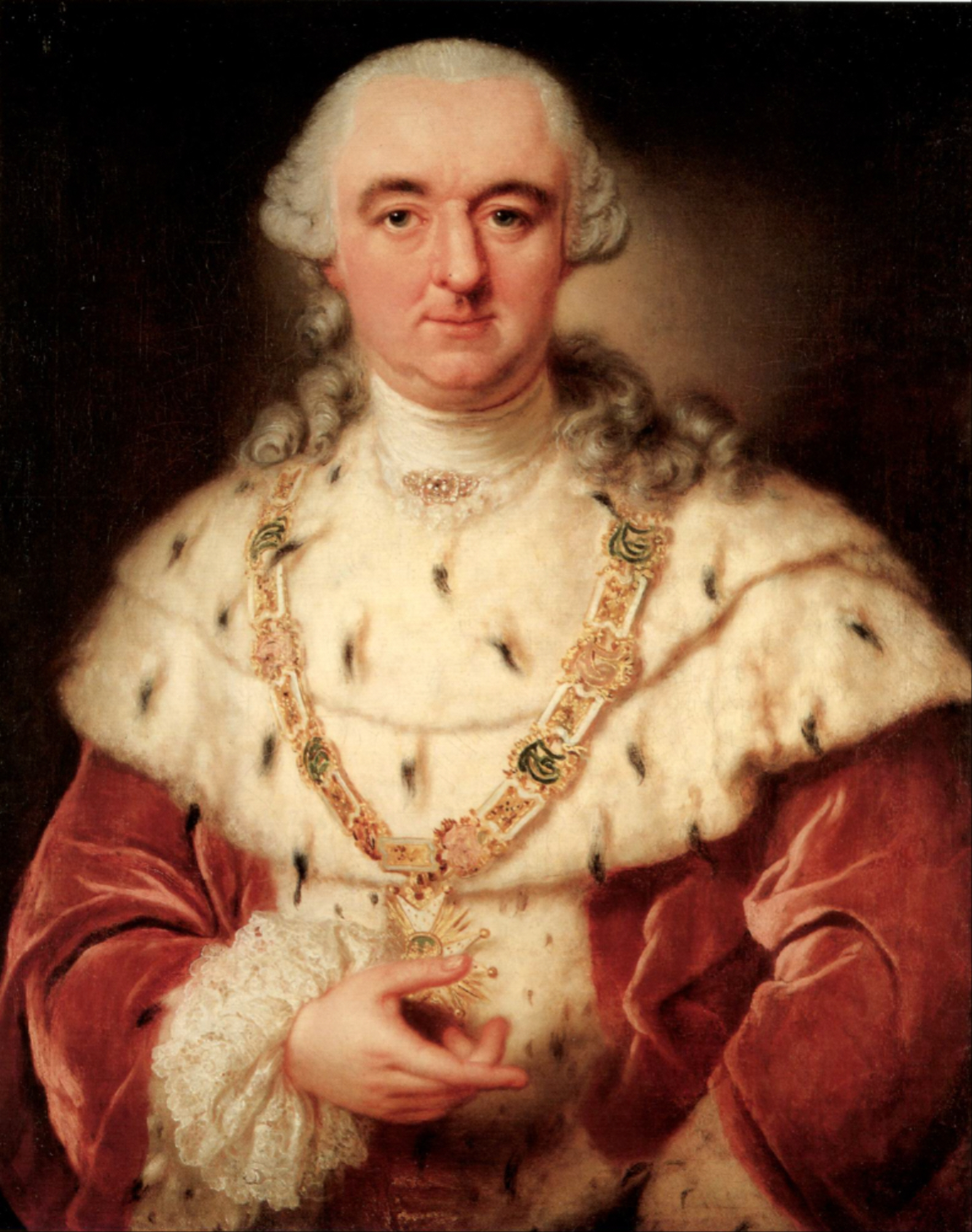 A half-length oil portrait of a heavy-featured older man in a powdered grey wig with rolled side curls falling to his shoulders. He wears an ermine cape, white with black tails, over crimson velvet sleeves, with a white stock and a lace cuff. A heavy gold and enamel collar of an order crosses his chest and he holds its gold starburst pendant in his right hand. A jewelled clasp sits at his throat. The background is dark and plain.