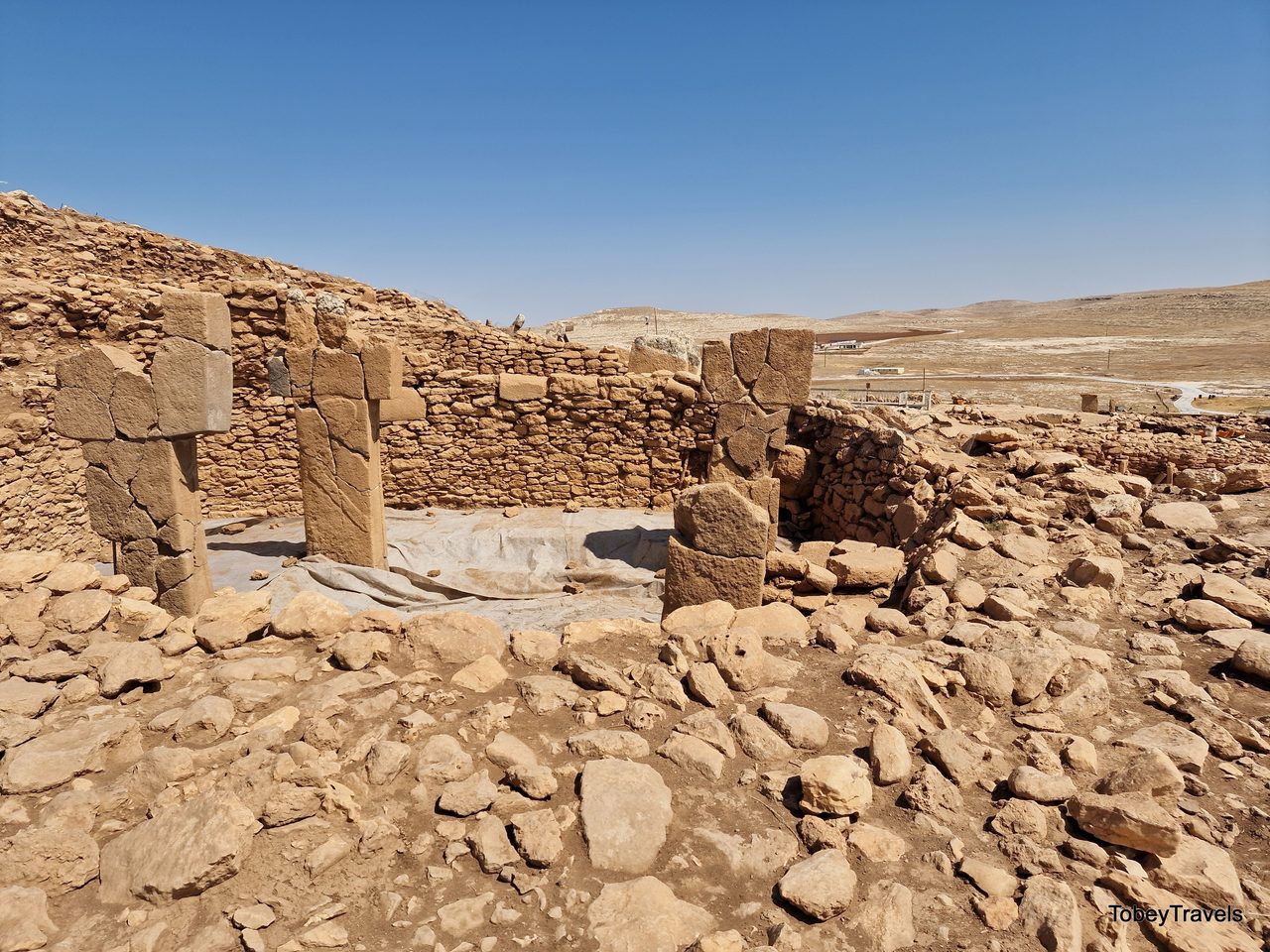 A Karahan Tepe enclosure with multiple T-shaped pillars standing in situ