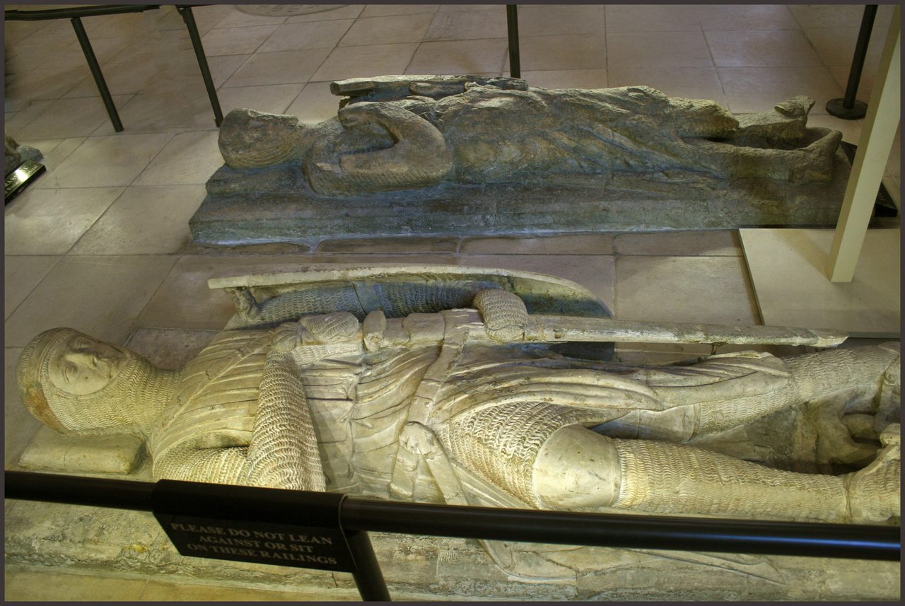 Marble effigies of medieval knights lying in repose inside the Temple Church, London