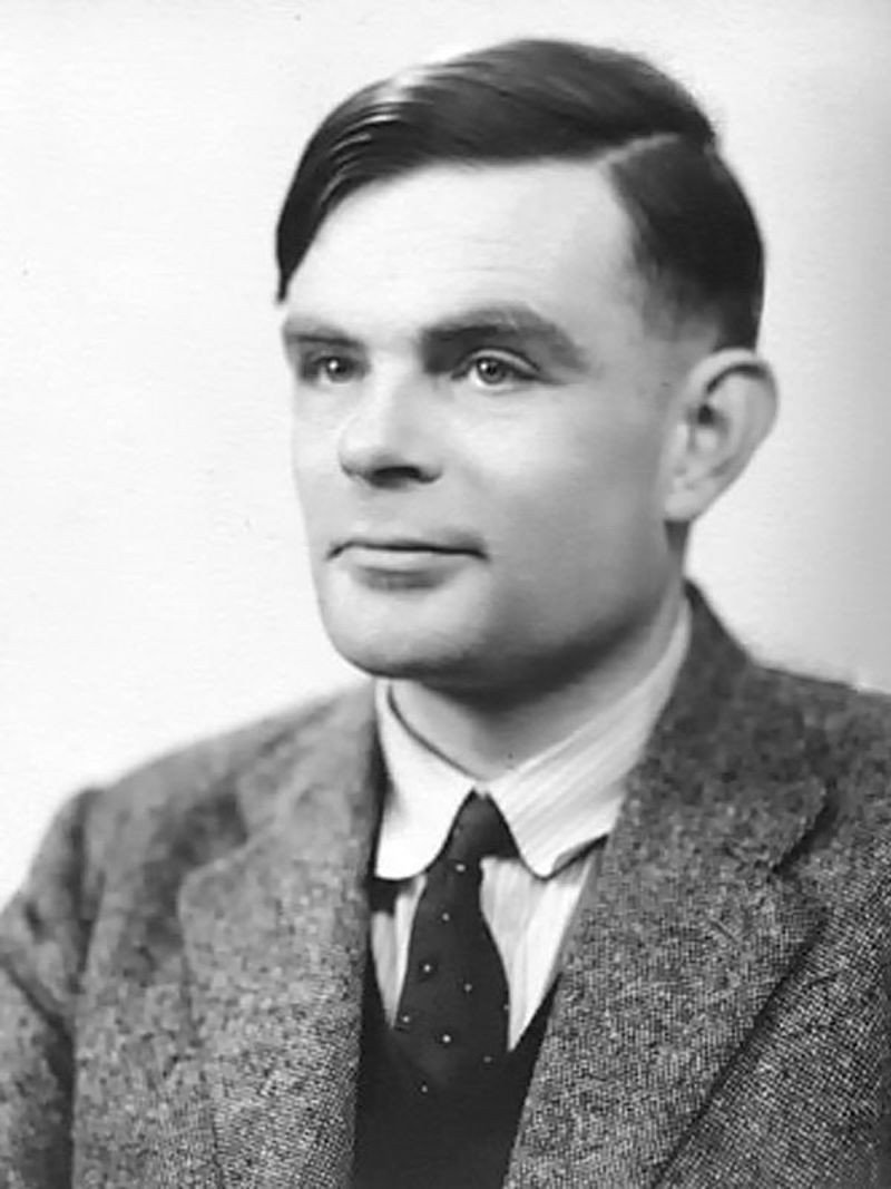 A 1951 studio portrait photograph of the mathematician Alan Turing