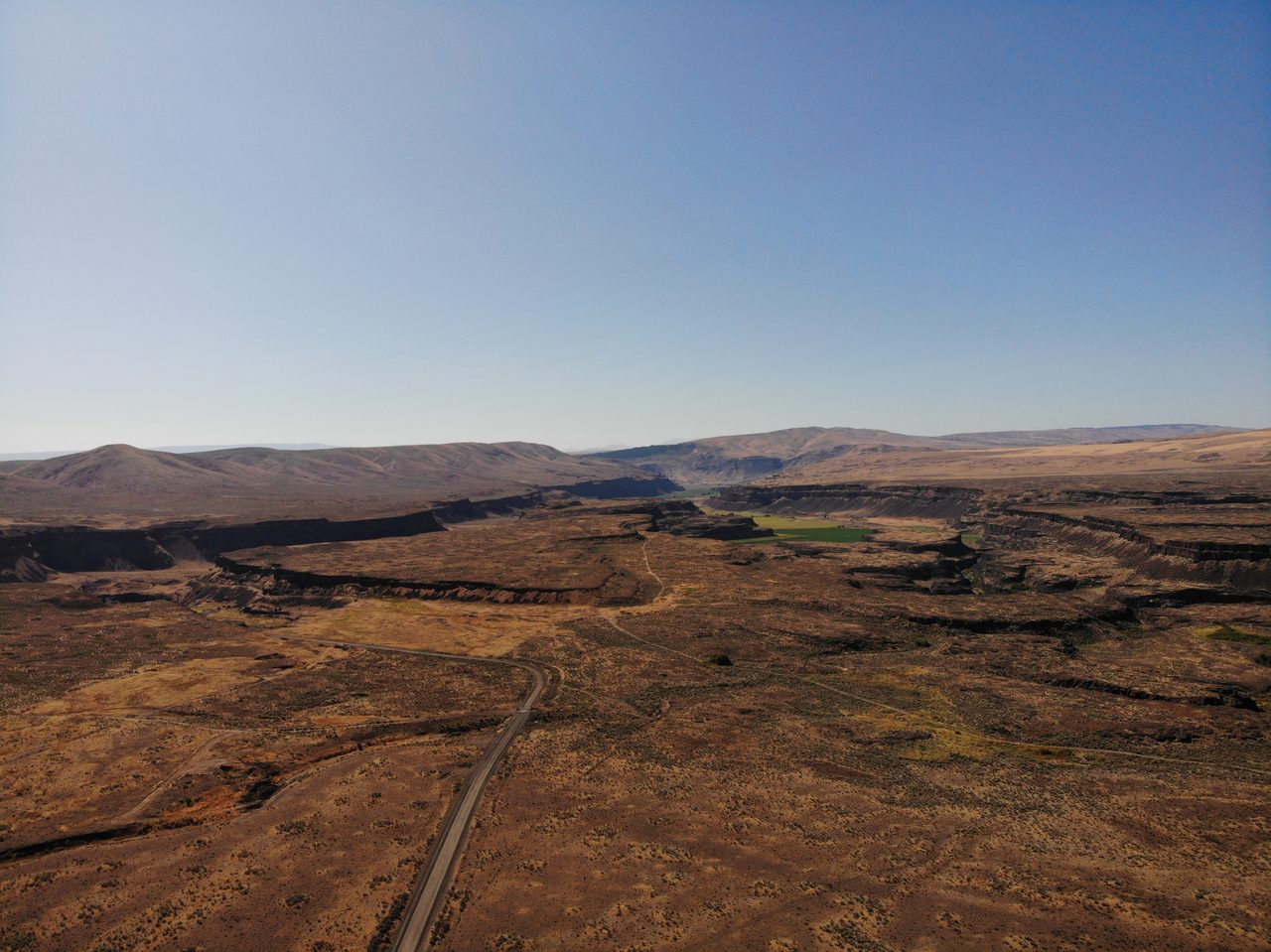 A wide view above Dry Falls, the 120 meter high, 5.5 kilometer wide abandoned waterfall carved by the Missoula Floods in central Washington