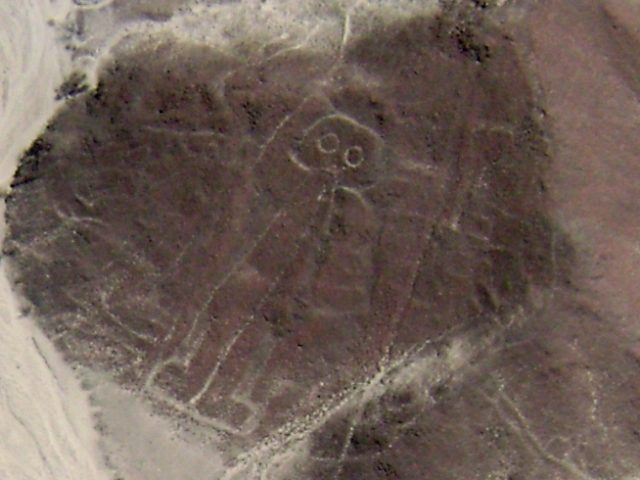 Aerial view of the hillside anthropomorphic figure at Palpa nicknamed the astronaut, a standing figure with a large rounded head