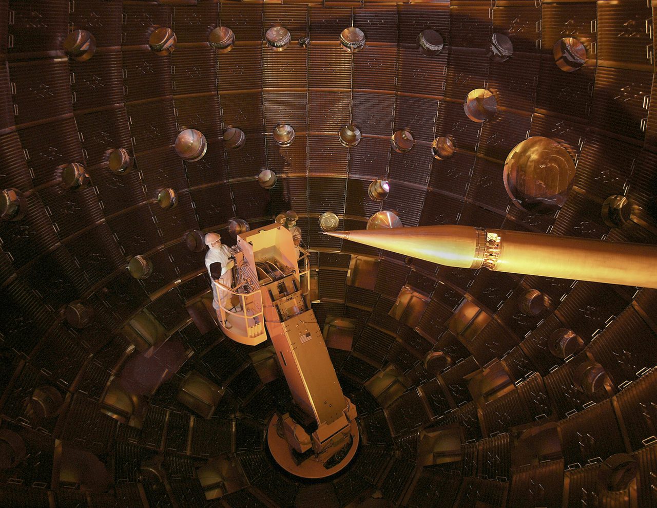 The interior of the National Ignition Facility's target chamber, a large spherical steel chamber studded with diagnostic ports