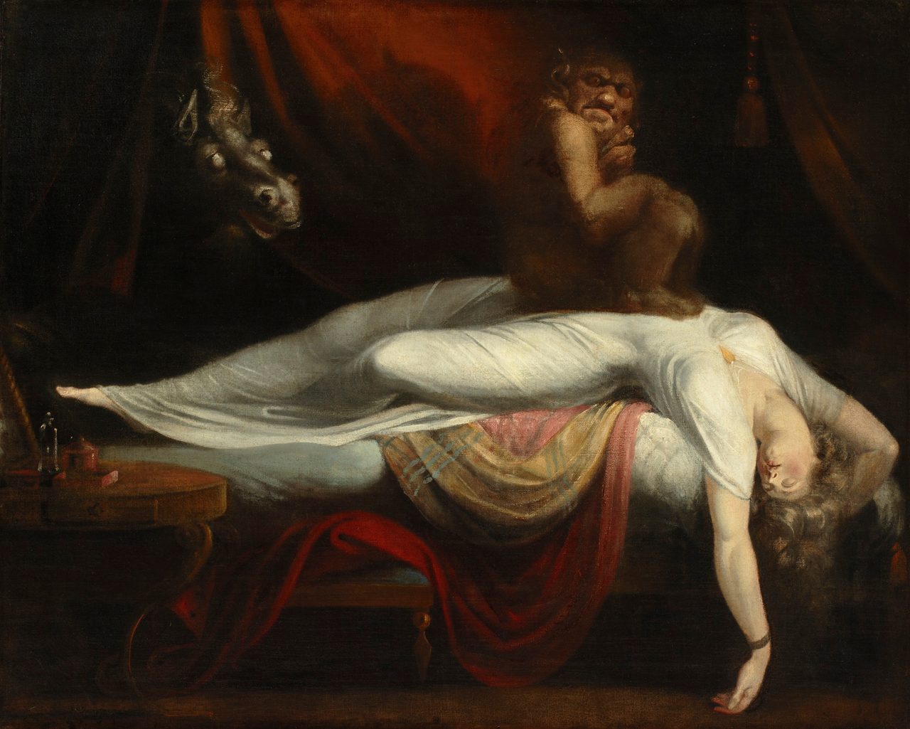 A dark oil painting of a woman in a white gown sprawled backwards across a bed with her head and arm hanging down, a small dark ape-like figure squatting on her chest, and a horse's head with pale blind eyes pushing through red curtains behind