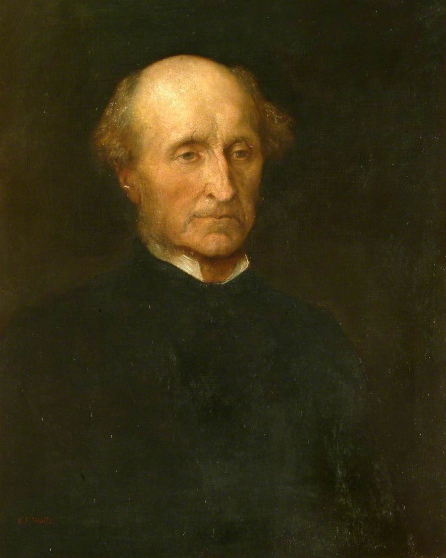 A sober Victorian oil portrait of John Stuart Mill as an older, balding man with side whiskers in dark clothing against a dark background, signed by the painter G.F. Watts