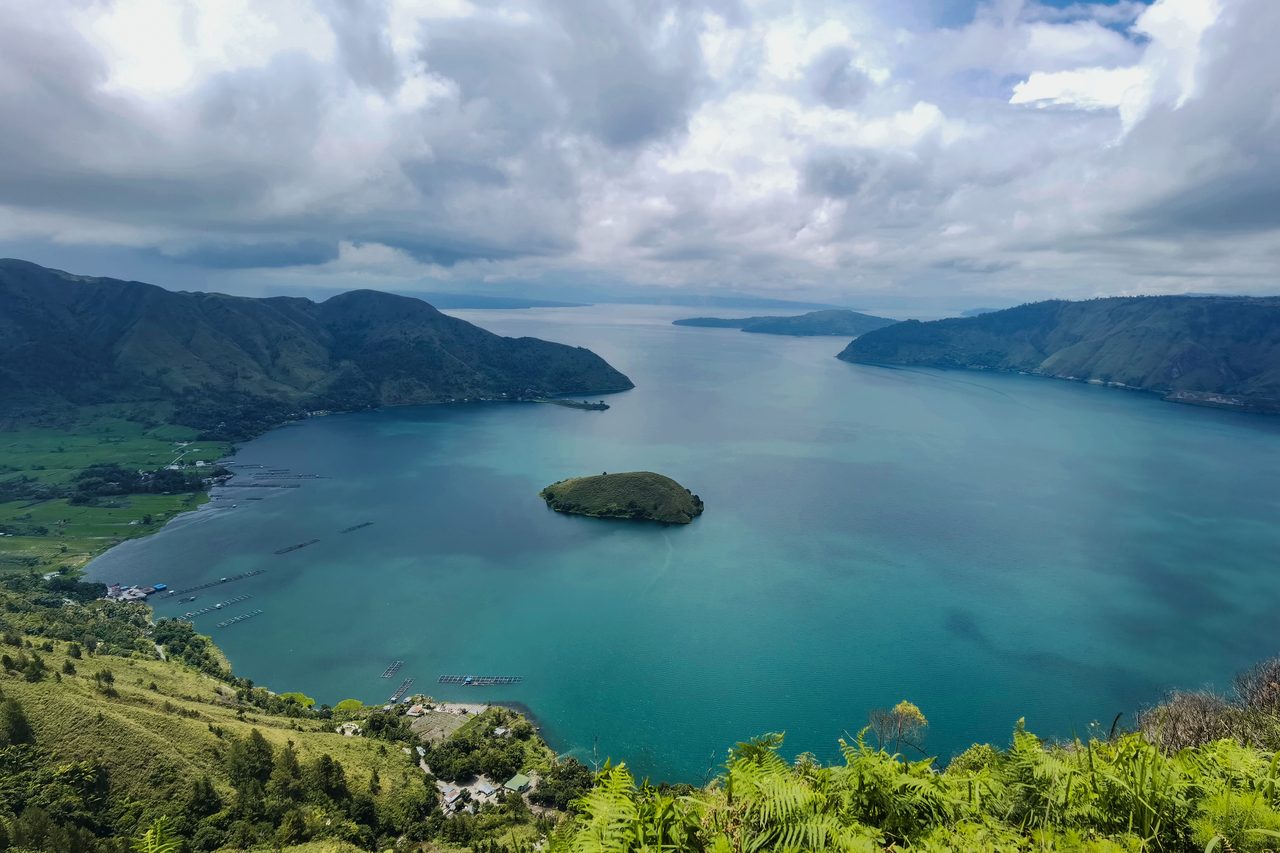 Lake Toba filling the caldera left by the supereruption, seen from the crater rim in Sumatra, Indonesia