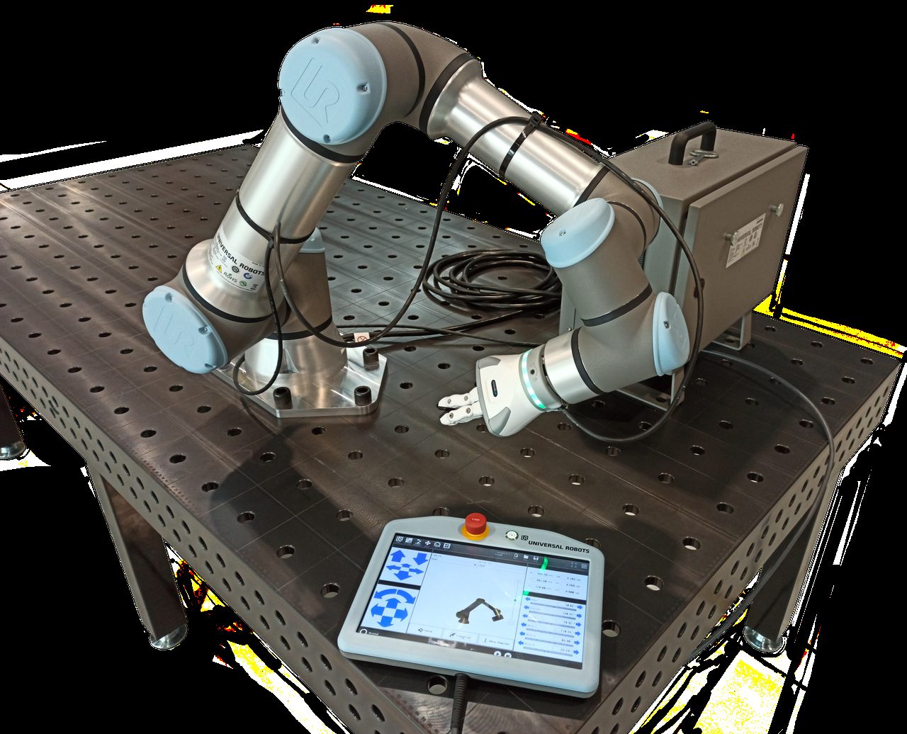 A collaborative robot arm from Universal Robots on a workbench, photographed with its controller unit and handheld programming pendant