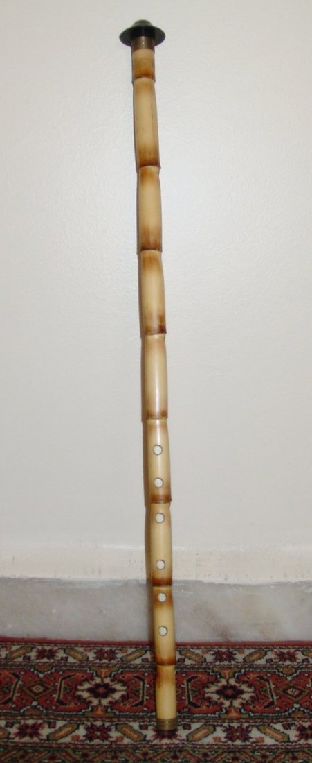 A close photograph of a ney, the end-blown reed flute used in Mevlevi ceremonial music